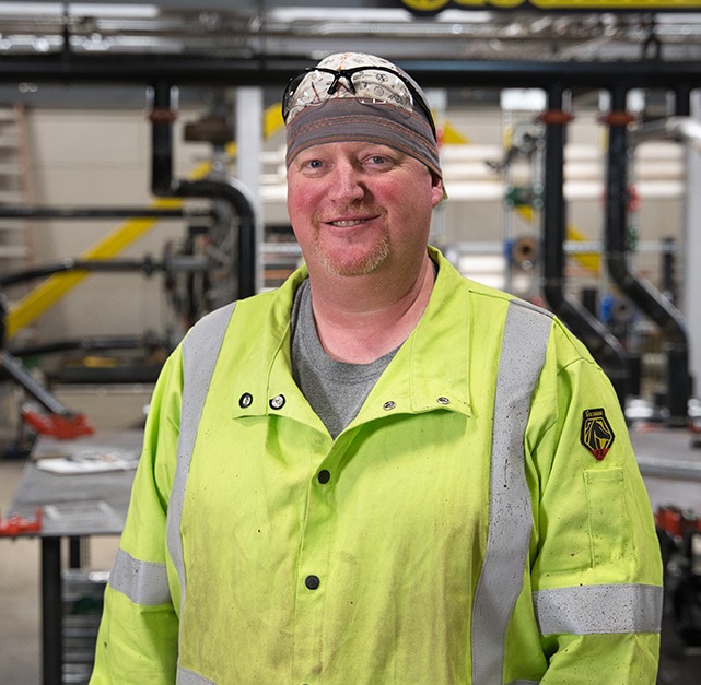 Steamfitters Apprentice standing in Technology Center workspace